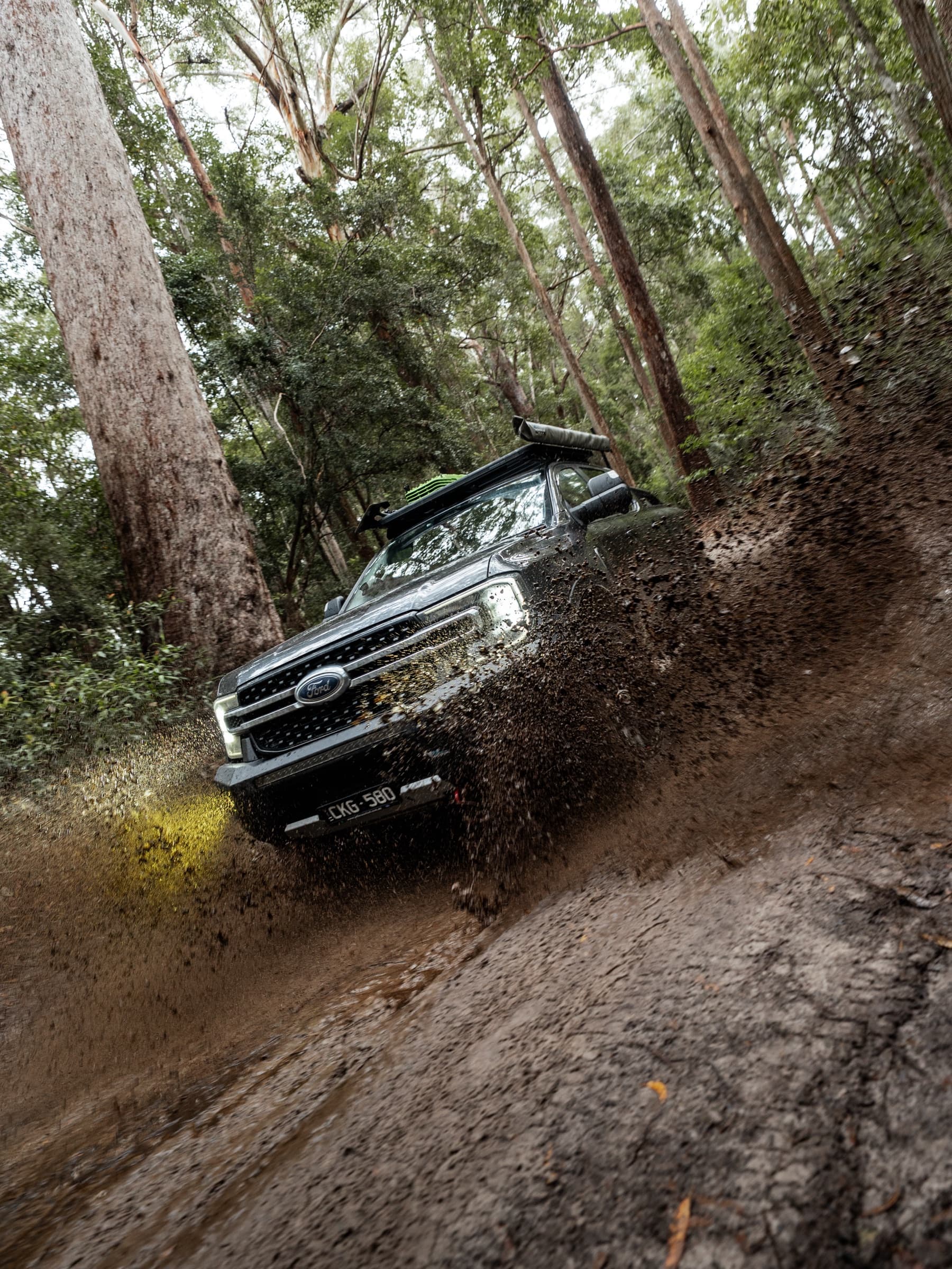 Tow vehicle on a muddy rainforest track