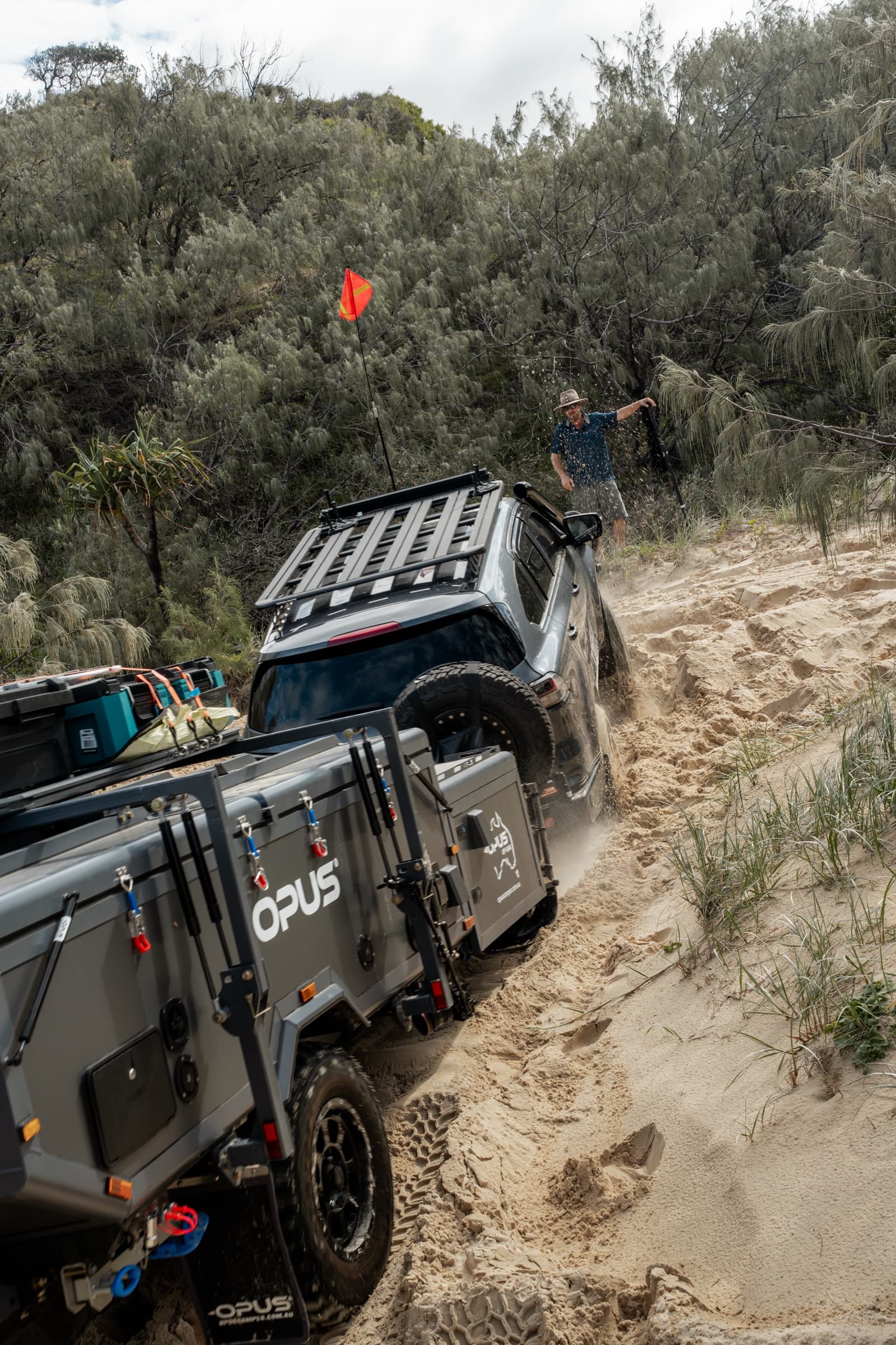 OPUS hybrid pulling up a sandy track