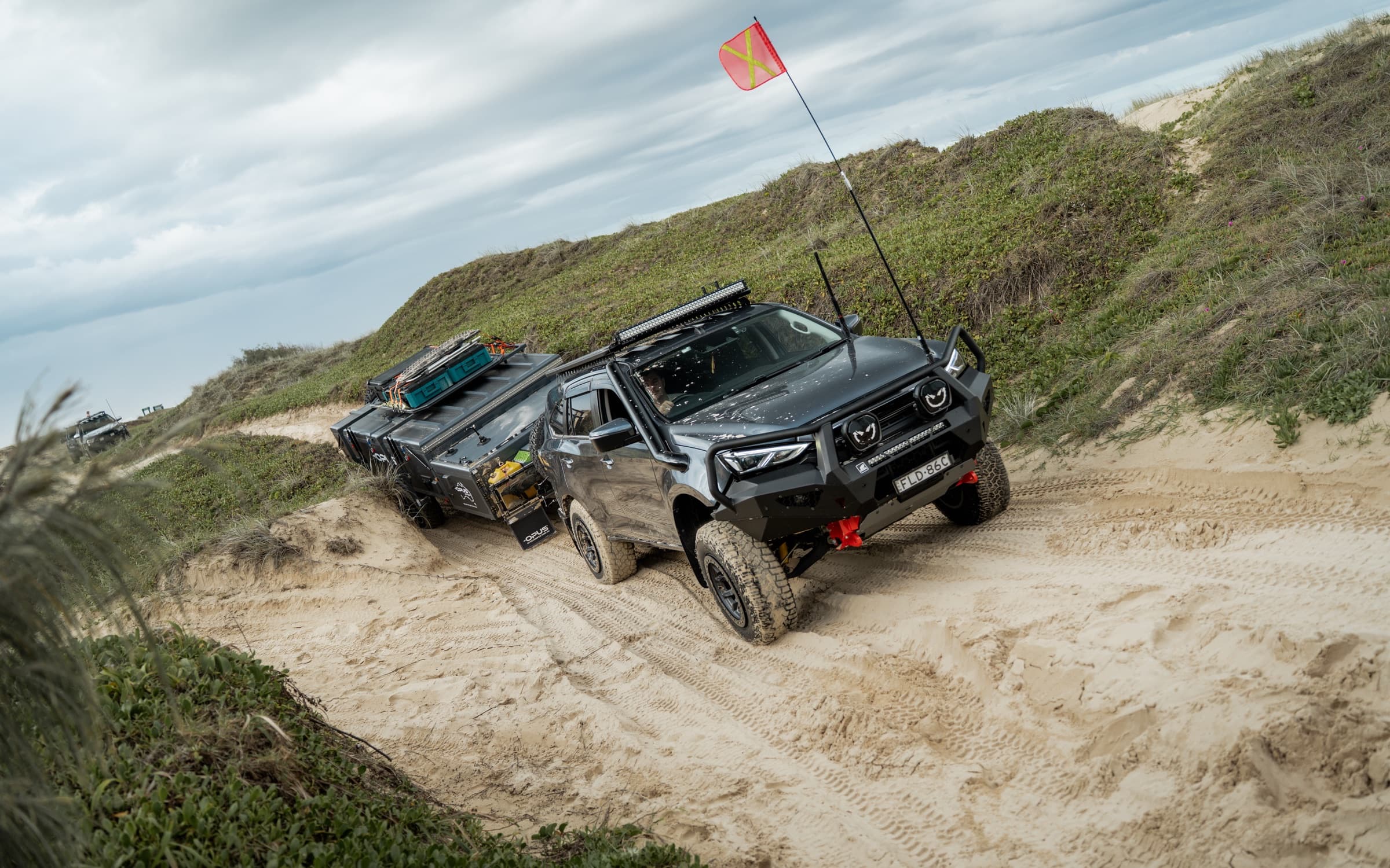OPUS rig climbing a soft sand exit track