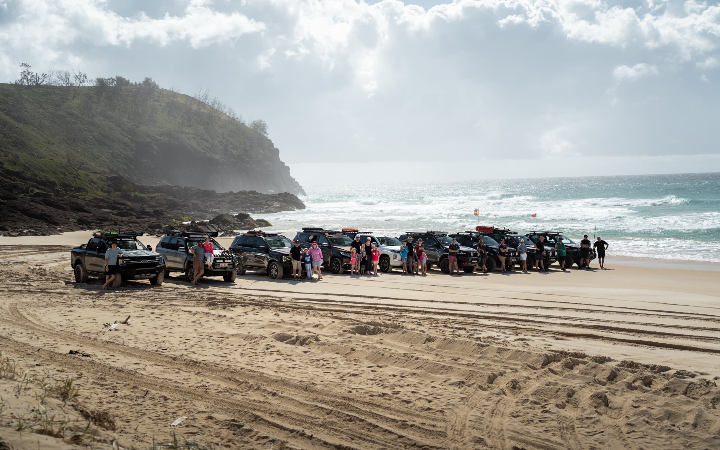 The full OPUS convoy lined up beneath a headland