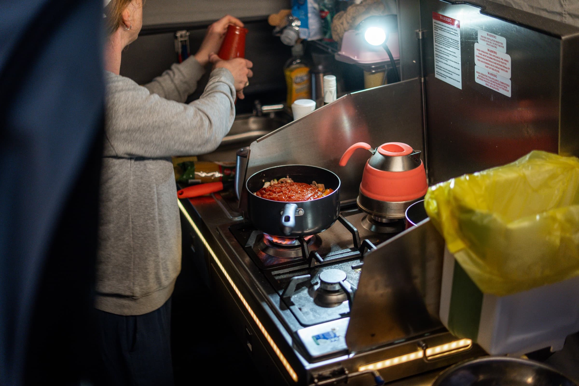 Dinner on the stove in an OPUS kitchen after dark