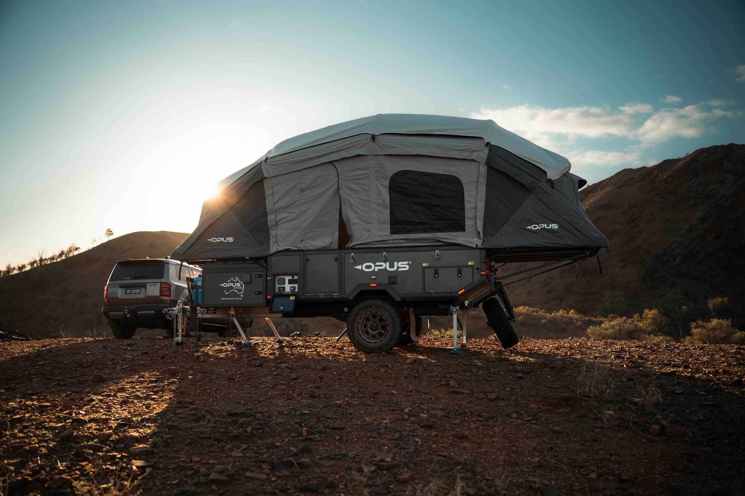 OPUS camper set up at golden hour
